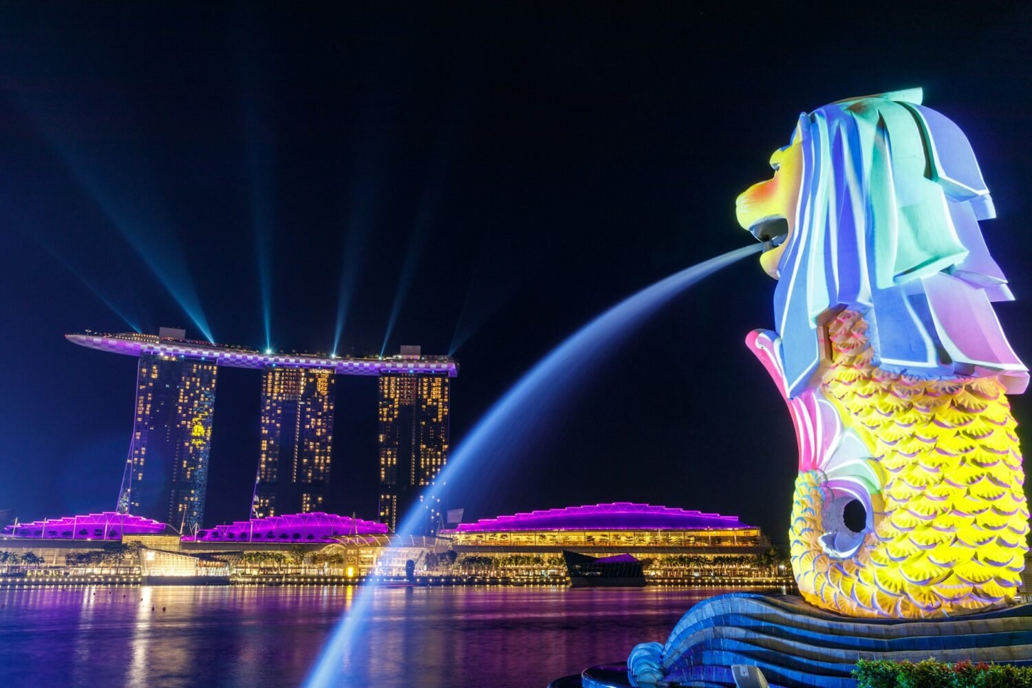 Lights shone on the Merlion as it overlooks Singapore's iconic Marina Bay Sands.