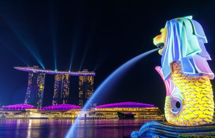 Lights shone on the Merlion as it overlooks Singapore's iconic Marina Bay Sands.